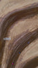 Overhead view of a motocross track with riders racing dirt bikes on it.