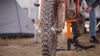 Close up shot of a motocross bike covered in mud after a race